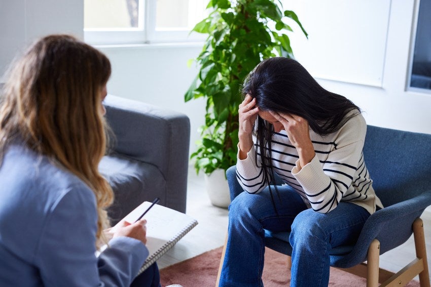 A Person seated anxiously during anxiety & depression therapy in Keller, TX